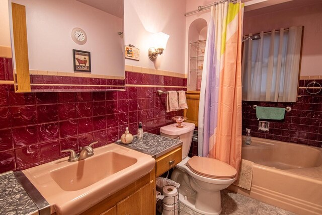 W9404 Porter Dr Unit W9408, Cambridge, WI 53523 - full bathroom featuring vanity, tile walls, shower / tub combo, and toilet