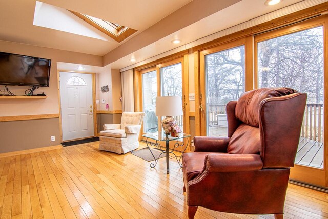 W9404 Porter Dr Unit W9408, Cambridge, WI 53523 - living area featuring recessed lighting, baseboards, a skylight, and hardwood / wood-style flooring