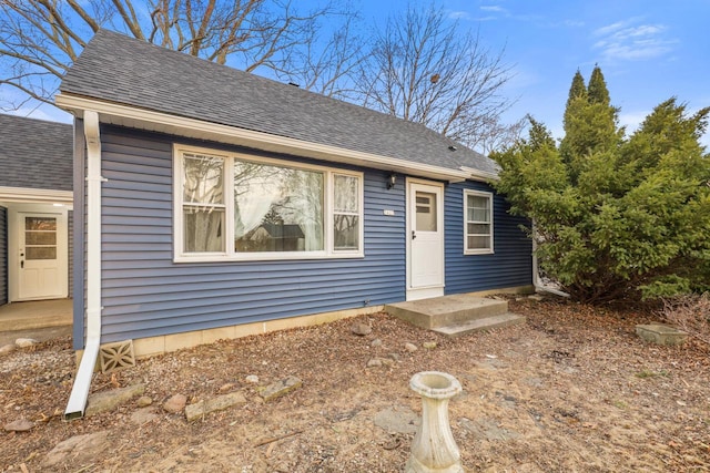 view of front of house featuring roof with shingles
