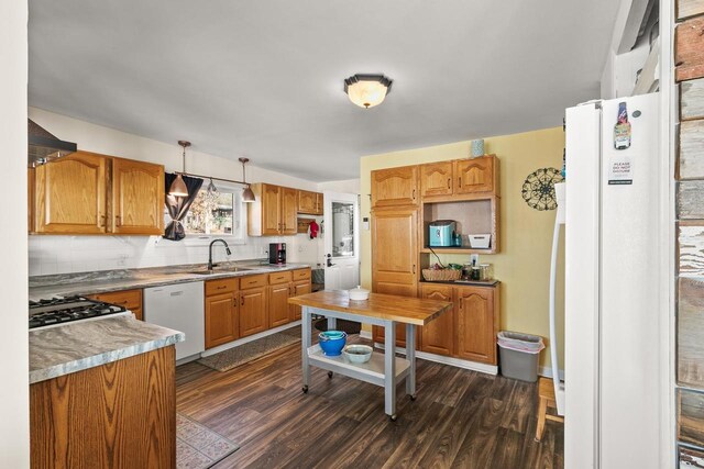 E13609 Idlewild Rd, Merrimac, WI 53561 - kitchen featuring decorative backsplash, white appliances, a sink, extractor fan, and dark wood-style floors