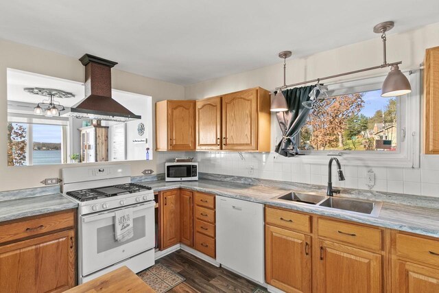 E13609 Idlewild Rd, Merrimac, WI 53561 - kitchen featuring a wealth of natural light, backsplash, a sink, white appliances, and island range hood