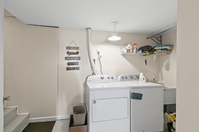 E13609 Idlewild Rd, Merrimac, WI 53561 - clothes washing area with washing machine and clothes dryer and laundry area