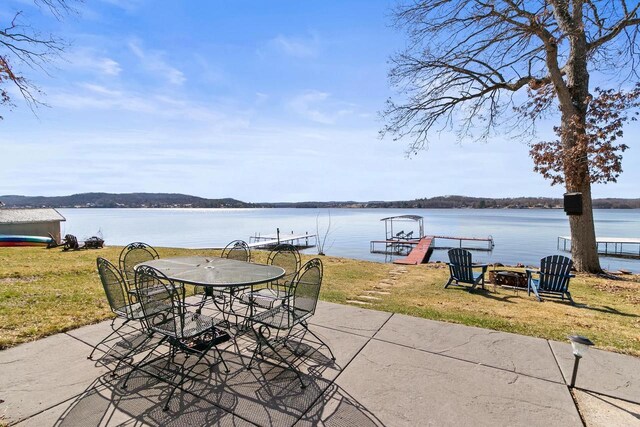 E13609 Idlewild Rd, Merrimac, WI 53561 - view of patio with a dock and a water view