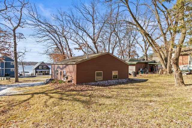 E13609 Idlewild Rd, Merrimac, WI 53561 - view of side of home with a yard