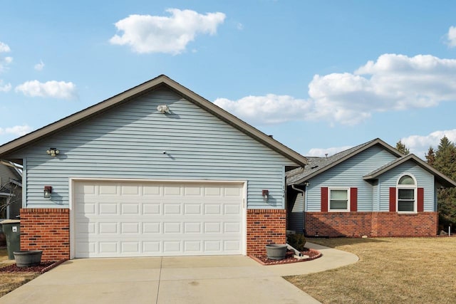 ranch-style home with a garage, a front yard, brick siding, and driveway