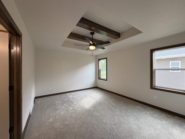 710 Tambour Ct Unit 3, De Pere, WI 54115 - spare room featuring carpet floors, beam ceiling, a ceiling fan, and baseboards