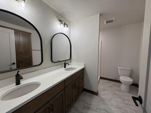 710 Tambour Ct Unit 3, De Pere, WI 54115 - full bathroom with marble look tile flooring, double vanity, toilet, and baseboards