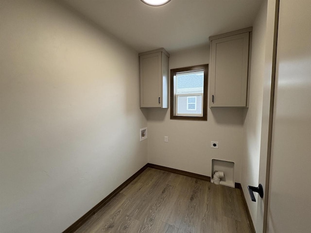 710 Tambour Ct Unit 3, De Pere, WI 54115 - washroom with cabinet space, wood finished floors, electric dryer hookup, baseboards, and washer hookup
