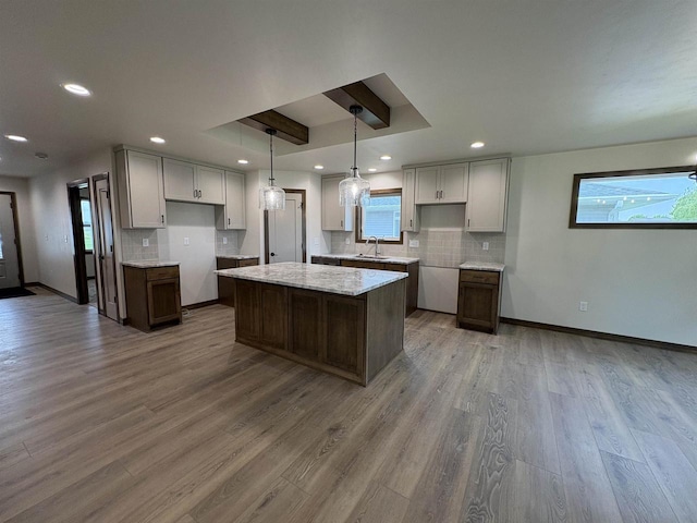 710 Tambour Ct Unit 3, De Pere, WI 54115 - kitchen featuring backsplash, a center island, a sink, plenty of natural light, and recessed lighting