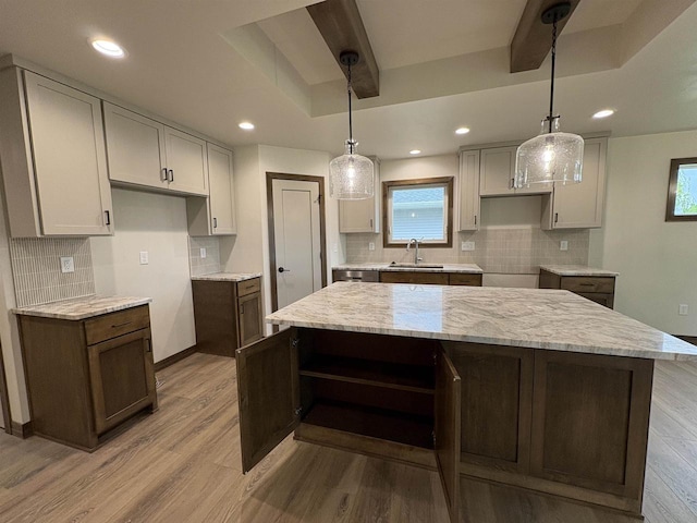 710 Tambour Ct Unit 3, De Pere, WI 54115 - kitchen featuring a sink, light wood-style floors, a kitchen island, backsplash, and recessed lighting
