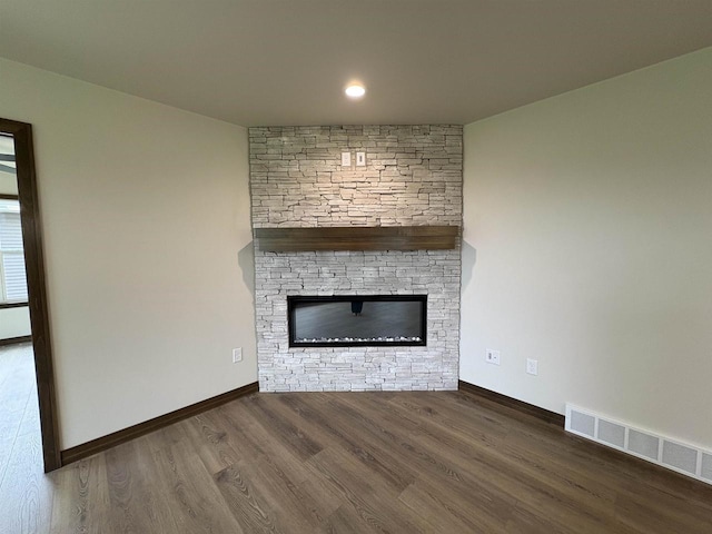 710 Tambour Ct Unit 3, De Pere, WI 54115 - unfurnished living room with a fireplace, wood finished floors, baseboards, and recessed lighting