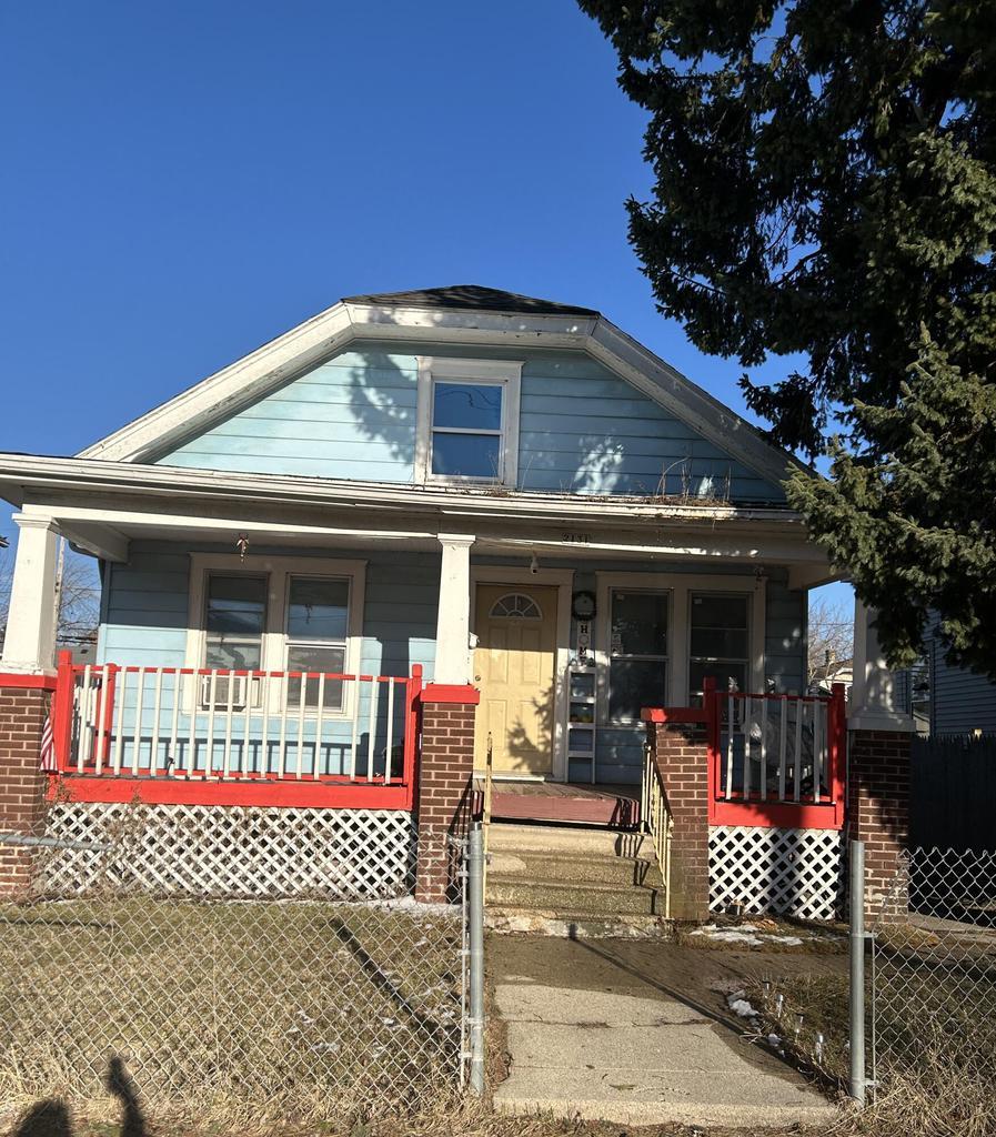 2131 Mead St, Mount Pleasant, WI 53403 - bungalow-style home featuring a porch and a fenced front yard