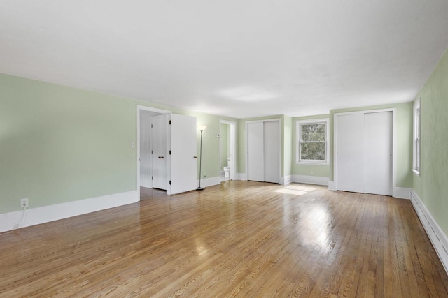 1203 Hewitt St, Neenah, WI 54956 - empty room featuring baseboards and light wood-style floors