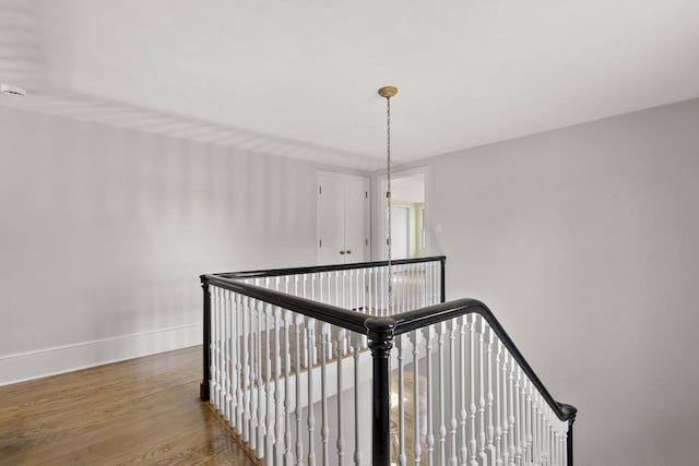 1203 Hewitt St, Neenah, WI 54956 - stairway featuring baseboards and wood finished floors