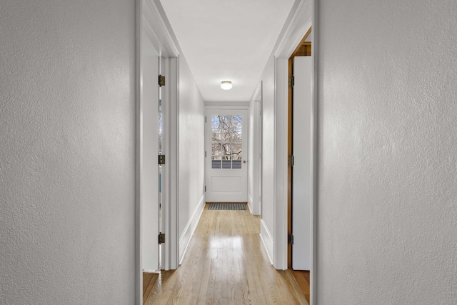 1203 Hewitt St, Neenah, WI 54956 - corridor featuring baseboards, a textured wall, and wood finished floors