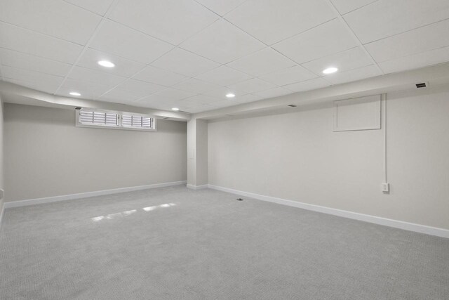 1203 Hewitt St, Neenah, WI 54956 - basement with a drop ceiling, recessed lighting, carpet, and baseboards