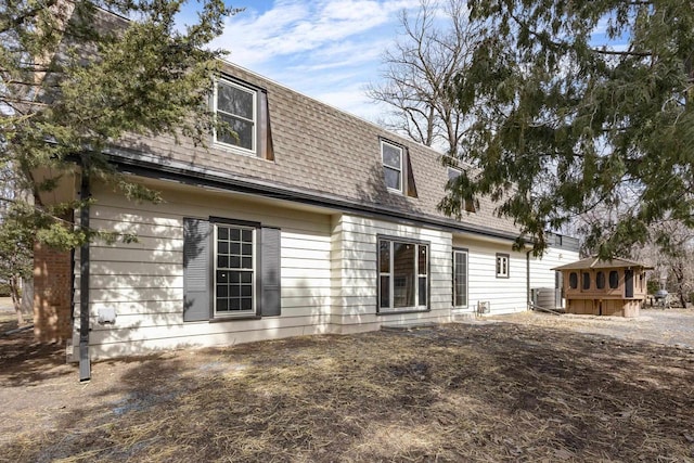 1203 Hewitt St, Neenah, WI 54956 - rear view of house with mansard roof and roof with shingles