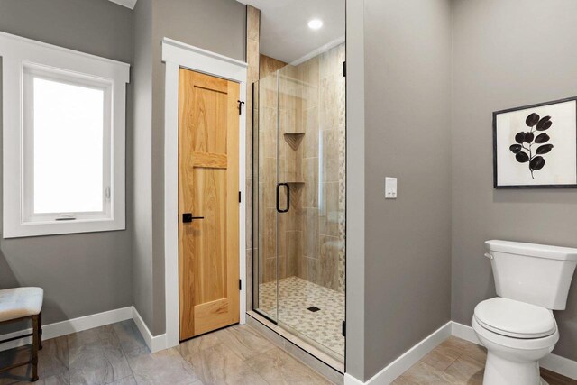 3814 W Fieldwood Dr, Janesville, WI 53545 - bathroom with baseboards, toilet, and a shower stall