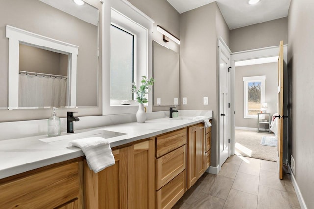3814 W Fieldwood Dr, Janesville, WI 53545 - bathroom with tile patterned flooring, double vanity, and a sink