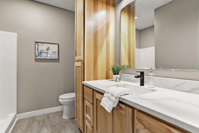 3814 W Fieldwood Dr, Janesville, WI 53545 - full bath featuring vanity, toilet, and baseboards