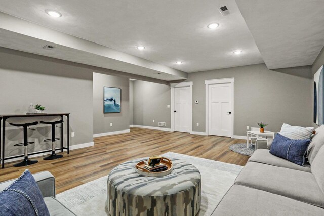 3814 W Fieldwood Dr, Janesville, WI 53545 - living room featuring visible vents, baseboards, and wood finished floors