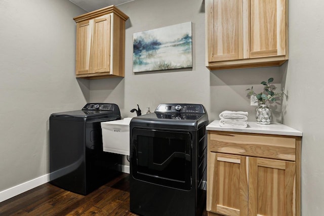 3814 W Fieldwood Dr, Janesville, WI 53545 - washroom featuring baseboards, cabinet space, washing machine and dryer, and dark wood-style flooring