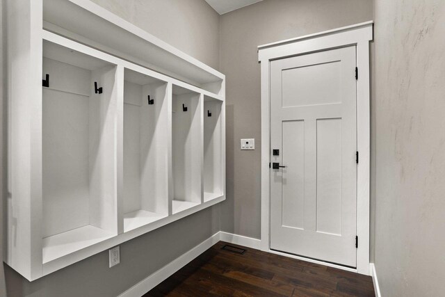 3814 W Fieldwood Dr, Janesville, WI 53545 - mudroom featuring baseboards and dark wood-style flooring