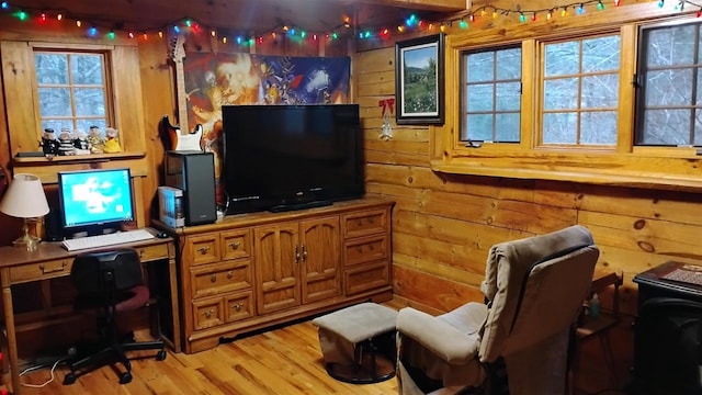 N4774 11th Dr, Montello, WI 53949 - living area with a desk, wood walls, and light wood-style floors