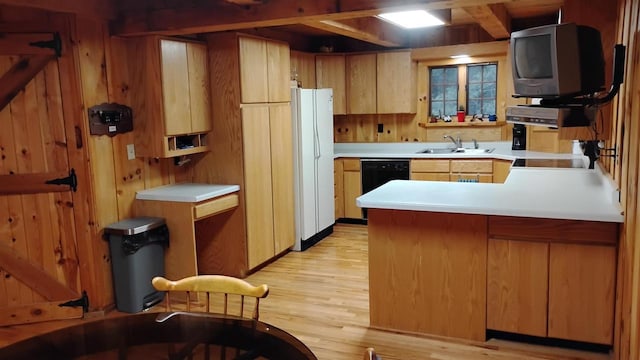 N4774 11th Dr, Montello, WI 53949 - kitchen with freestanding refrigerator, dishwasher, a sink, a peninsula, and light countertops