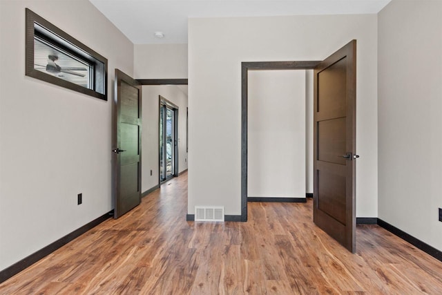 1644 Kingswood Trl, Nekoosa, WI 54457 - unfurnished bedroom with light wood finished floors and baseboards