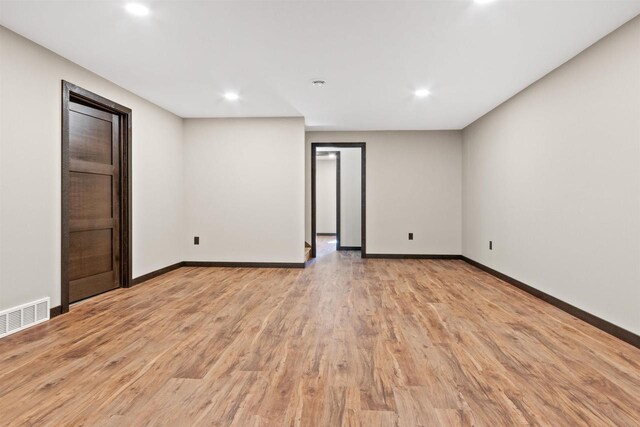 1644 Kingswood Trl, Nekoosa, WI 54457 - empty room with light wood-type flooring, baseboards, and recessed lighting