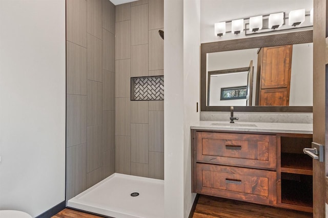 1644 Kingswood Trl, Nekoosa, WI 54457 - bathroom with a shower stall, vanity, and wood finished floors