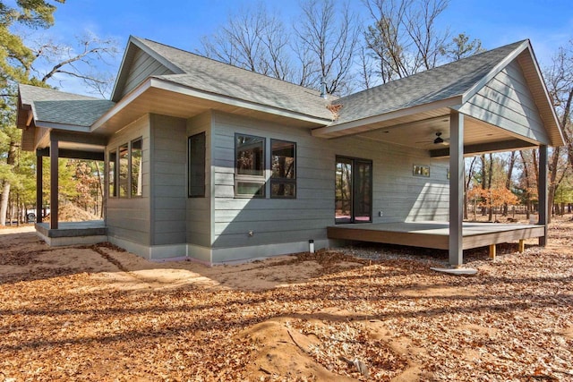 1644 Kingswood Trl, Nekoosa, WI 54457 - view of property exterior featuring roof with shingles, a ceiling fan, and a deck