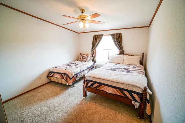N7957 15th Ave, New Lisbon, WI 53950 - carpeted bedroom featuring ceiling fan, crown molding, baseboards, and a textured wall