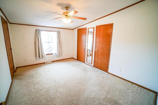 N7957 15th Ave, New Lisbon, WI 53950 - unfurnished bedroom featuring visible vents, baseboards, carpet, and ornamental molding