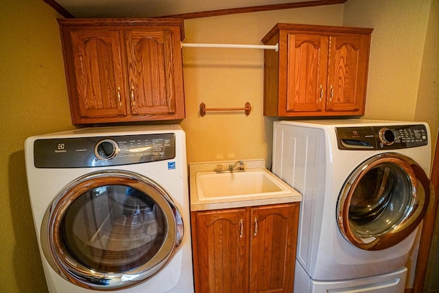 N7957 15th Ave, New Lisbon, WI 53950 - laundry area featuring separate washer and dryer, cabinet space, and a sink