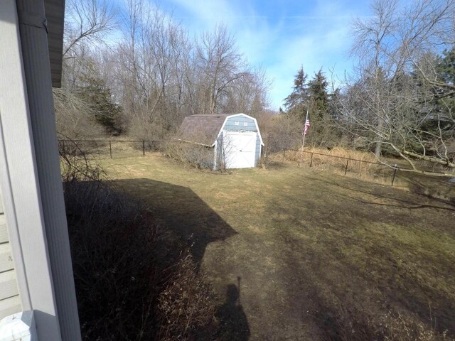 N2798 Little Green Rd, Markesan, WI 53946 - view of yard with an outbuilding, fence, and a storage shed