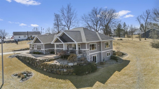 301 Church St, Barneveld, WI 53507 - back of house featuring stone siding and a shingled roof