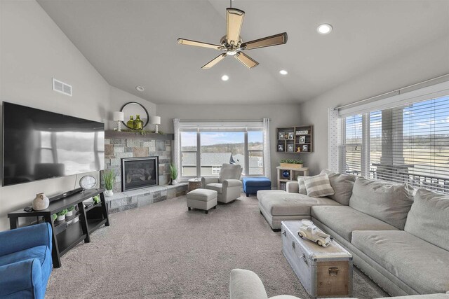 301 Church St, Barneveld, WI 53507 - carpeted living area with visible vents, lofted ceiling, recessed lighting, ceiling fan, and a stone fireplace