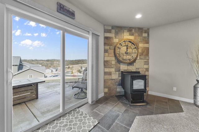 301 Church St, Barneveld, WI 53507 - interior space with a wood stove, recessed lighting, and baseboards