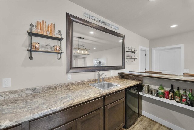 301 Church St, Barneveld, WI 53507 - bathroom with recessed lighting, baseboards, wood finished floors, and vanity