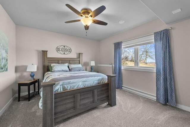 301 Church St, Barneveld, WI 53507 - bedroom featuring a ceiling fan, baseboards, baseboard heating, and carpet floors