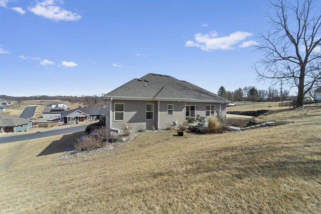301 Church St, Barneveld, WI 53507 - rear view of house with a yard and roof with shingles