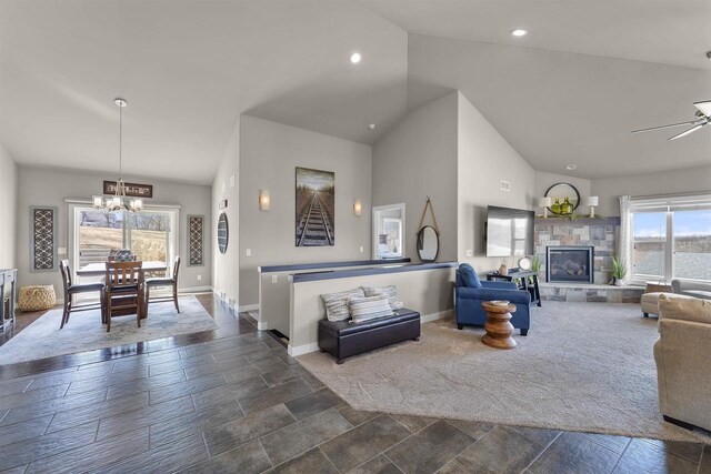 301 Church St, Barneveld, WI 53507 - living area with dark colored carpet, baseboards, high vaulted ceiling, and a fireplace