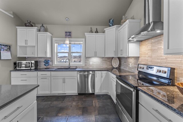 301 Church St, Barneveld, WI 53507 - kitchen featuring a sink, stainless steel appliances, white cabinets, and wall chimney range hood