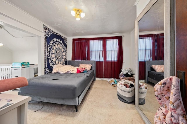 carpeted bedroom featuring crown molding