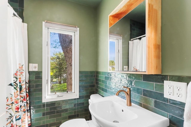 44 Oakwood St, Williams Bay, WI 53191 - full bath with a sink, tile walls, toilet, and a wainscoted wall