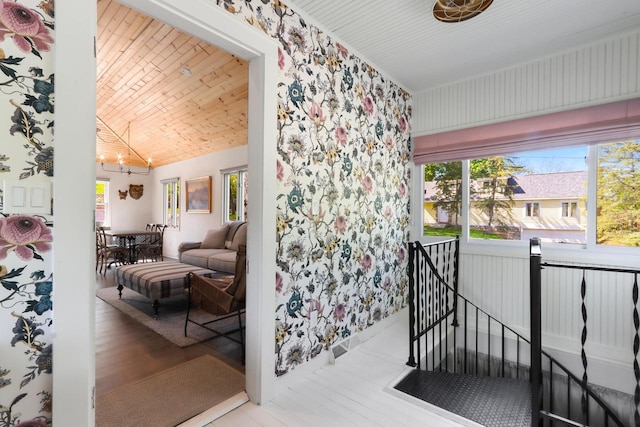 44 Oakwood St, Williams Bay, WI 53191 - living area with healthy amount of natural light, a chandelier, vaulted ceiling, wood ceiling, and wood finished floors