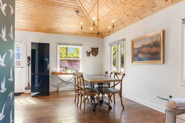44 Oakwood St, Williams Bay, WI 53191 - dining area with wood ceiling, a chandelier, vaulted ceiling, hardwood / wood-style flooring, and baseboards