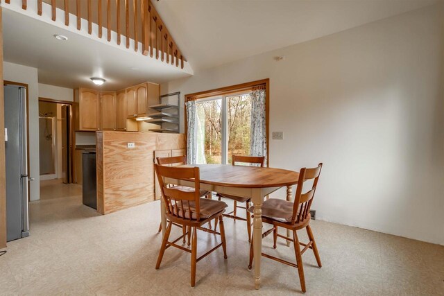 1735 W 19th Ave, Arkdale, WI 54613 - dining space featuring light floors and a towering ceiling